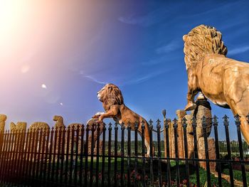 Low angle view of statue against sky