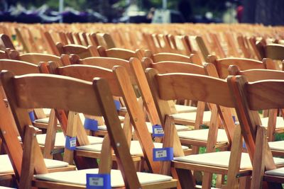 Empty wooden chairs arranged