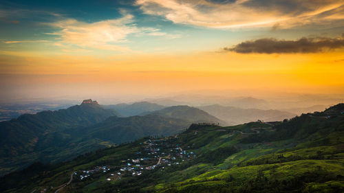 Scenic view of mountains against sky during sunset