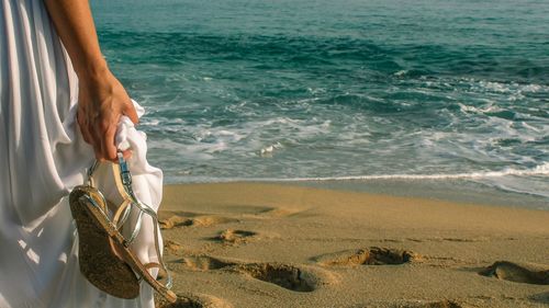 Woman standing on beach