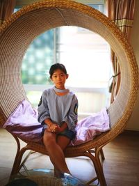 Portrait of girl sitting on chair