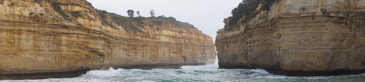Scenic view of rock formations in sea