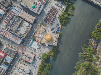 High angle view of buildings by river in city