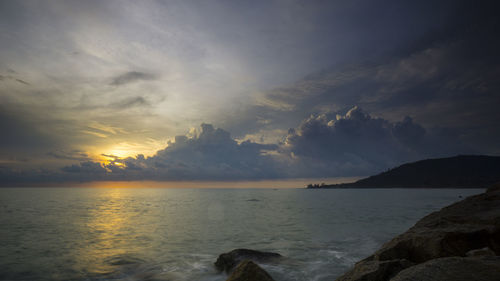 Scenic view of sea against sky at sunset