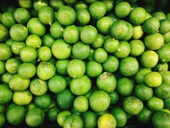 Full frame shot of green citrus fruit for sale in market