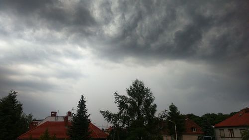 High section of house against cloudy sky