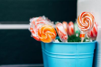 Close-up of lollipops in bucket