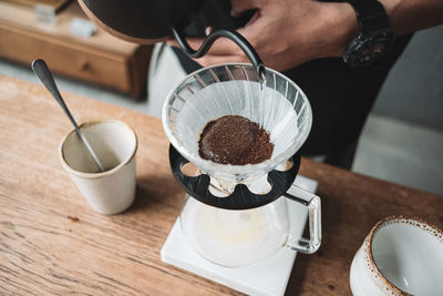 Barista dripping coffee and slow coffee bar style