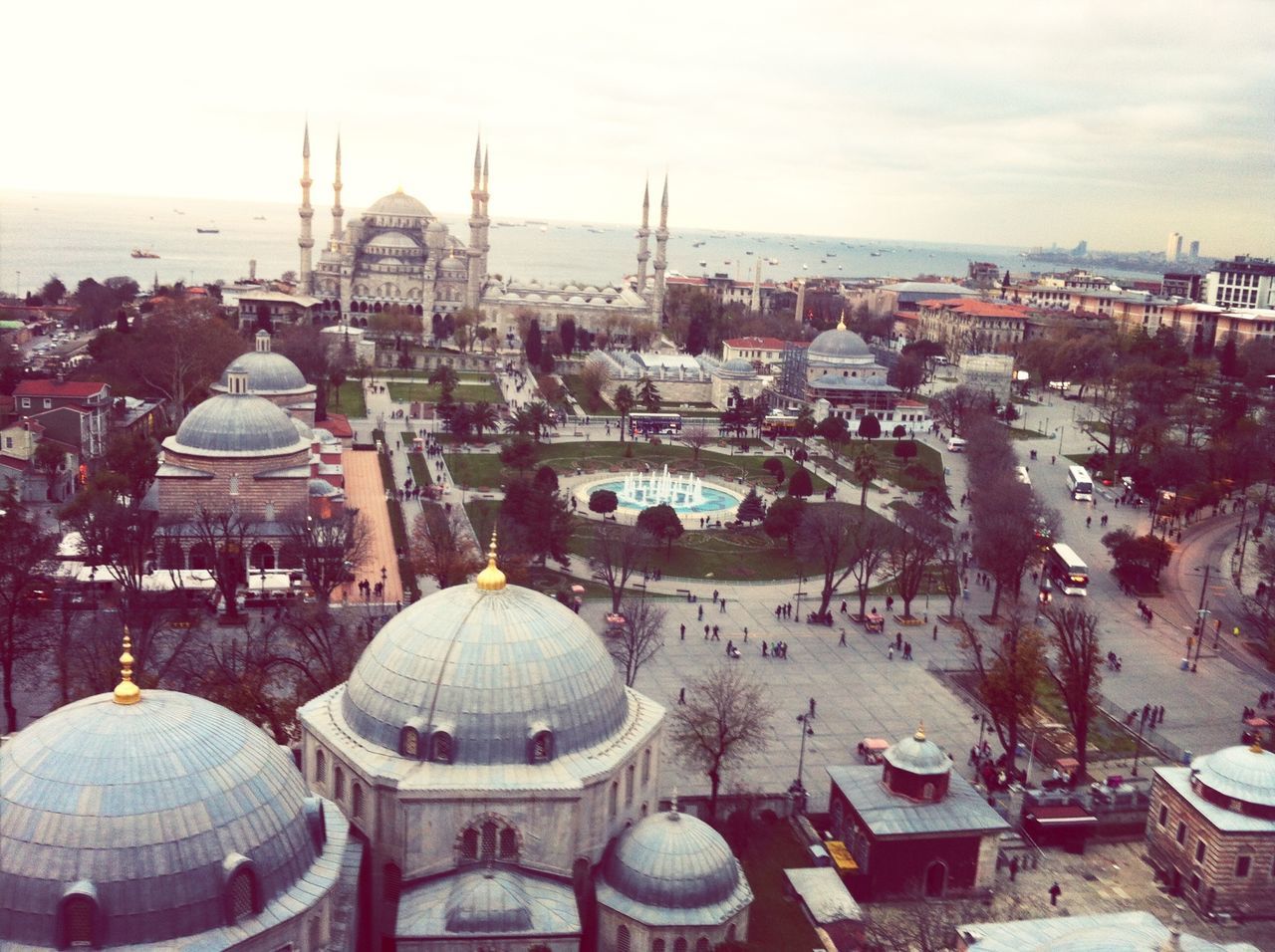 architecture, building exterior, built structure, dome, sky, religion, place of worship, city, spirituality, travel destinations, tourism, travel, famous place, cityscape, islam, water, high angle view, outdoors, mosque, sea