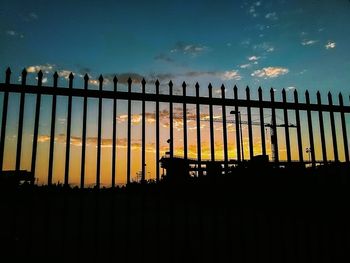 Silhouette built structure against sky at night