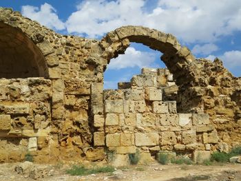 Old ruins of building against cloudy sky