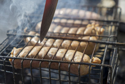 High angle view of meat on barbecue grill