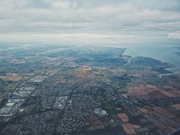 Aerial view of city and buildings against sky