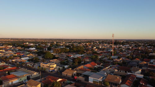 High angle view of townscape against clear sky during sunset