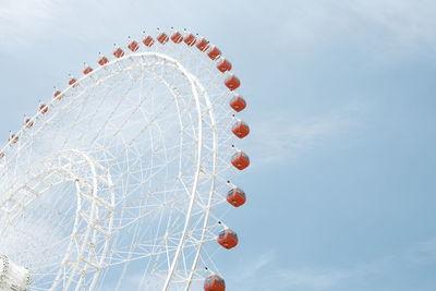 Low angle view of ferris wheel against sky