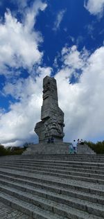 Low angle view of historical building against cloudy sky