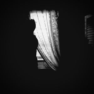 Woman in dark room