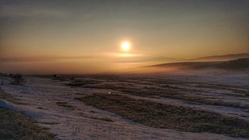 Scenic view of land during sunset