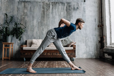 A man engaged in yoga and meditation, performing asanas