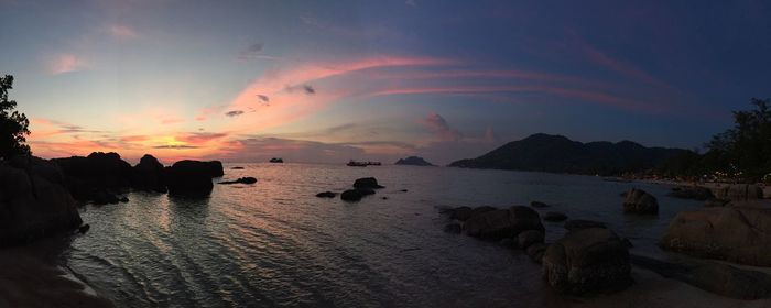 Scenic view of sea against cloudy sky