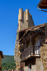 Low angle view of old building against clear sky