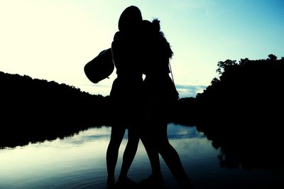 Silhouette of people at sunset