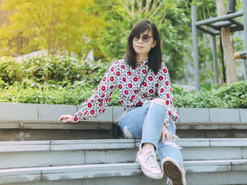 Portrait of girl sitting on staircase