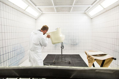 Man working in bathroom