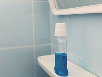 Close-up of blue drinking glass on table