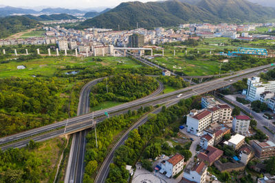 High angle view of road amidst buildings in city