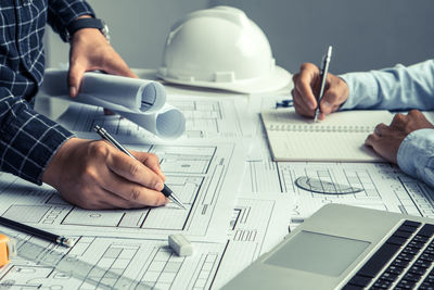 Low angle view of man working on table