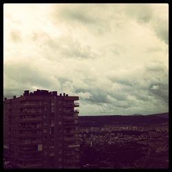 Built structure against cloudy sky