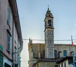 Low angle view of bell tower against sky