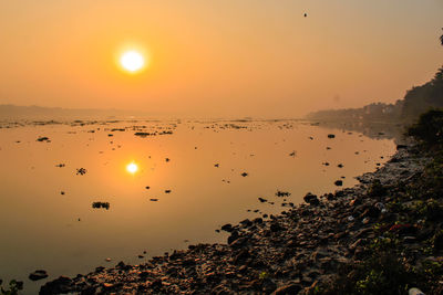 Scenic view of sea against sky during sunset