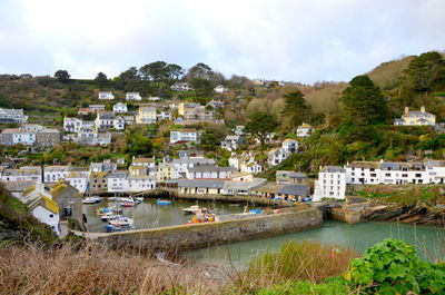 Town by river and buildings in city