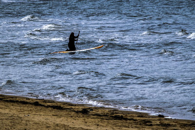 Man surfing in sea