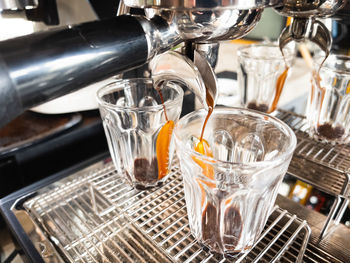 Close-up of wine glasses in glass