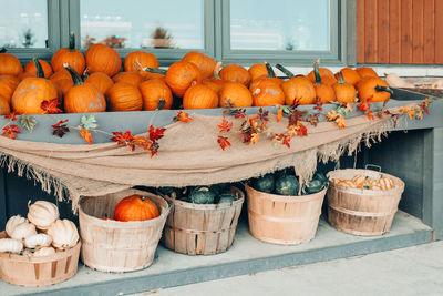 Pumpkins in baskets. autumn fall harvest. store outdoor decoration. thanksgiving and halloween 