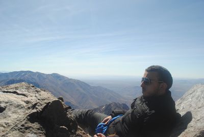 Man on mountains against sky