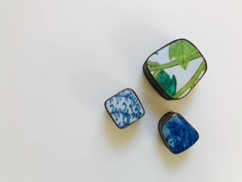 High angle view of multi colored pencils on white background