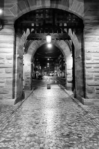 Man walking in corridor of building