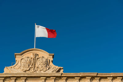 Low angle view of statue against clear blue sky