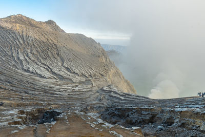 Scenic view of volcanic mountain against sky