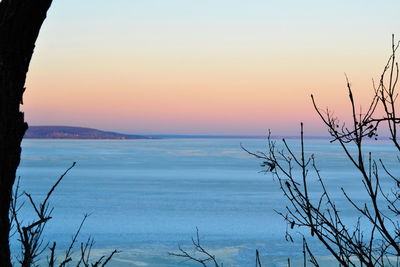 Scenic view of sea against sky at sunset