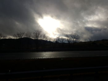 Scenic view of lake against sky at sunset