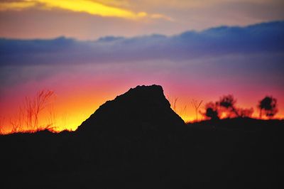 Scenic view of silhouette mountain against sky during sunset