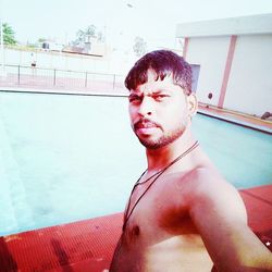 Young man in swimming pool