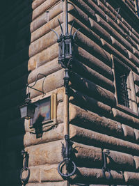 Low angle view of brick wall and building