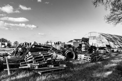 Abandoned truck on field against sky