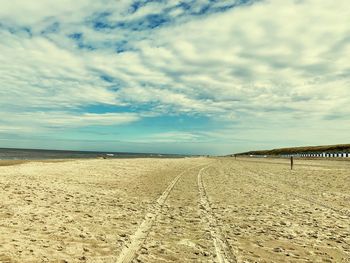 Scenic view of beach against sky